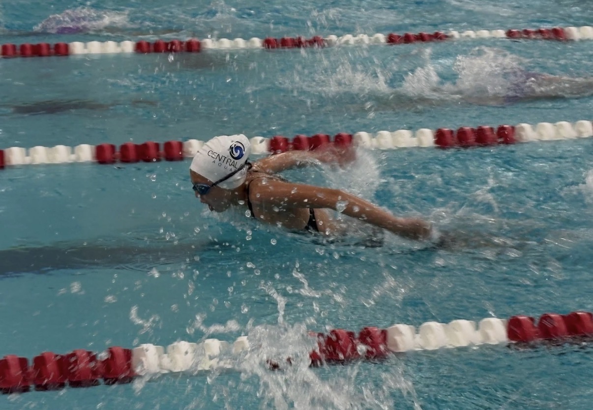 Aspyn racing butterfly in lane